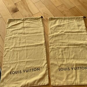 Two huge LV dust bags can use as a pillow if you want.